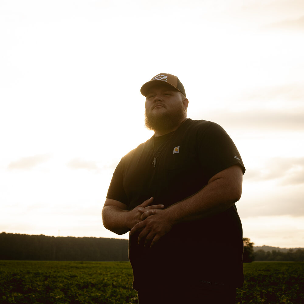Hank Singleton at golden hour in a field